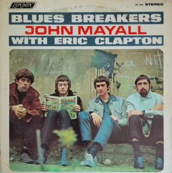 a group of people standing in front of a book