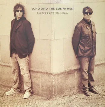 a couple of people that are standing in front of a building