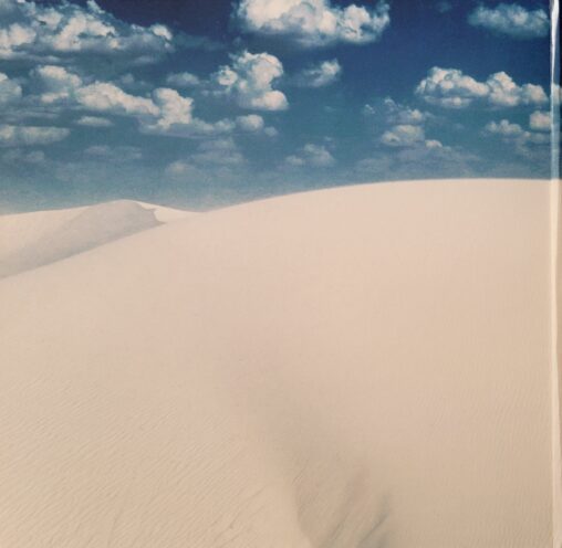a close up of clouds in the sand