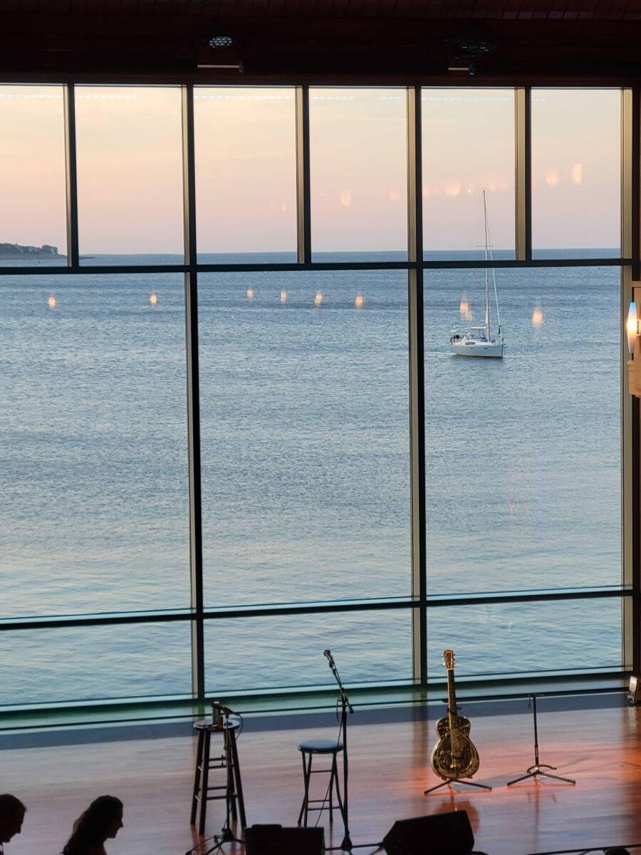 Shalin Liu Performing Arts Center, Rockport MA - with a sailboat visible through the window 