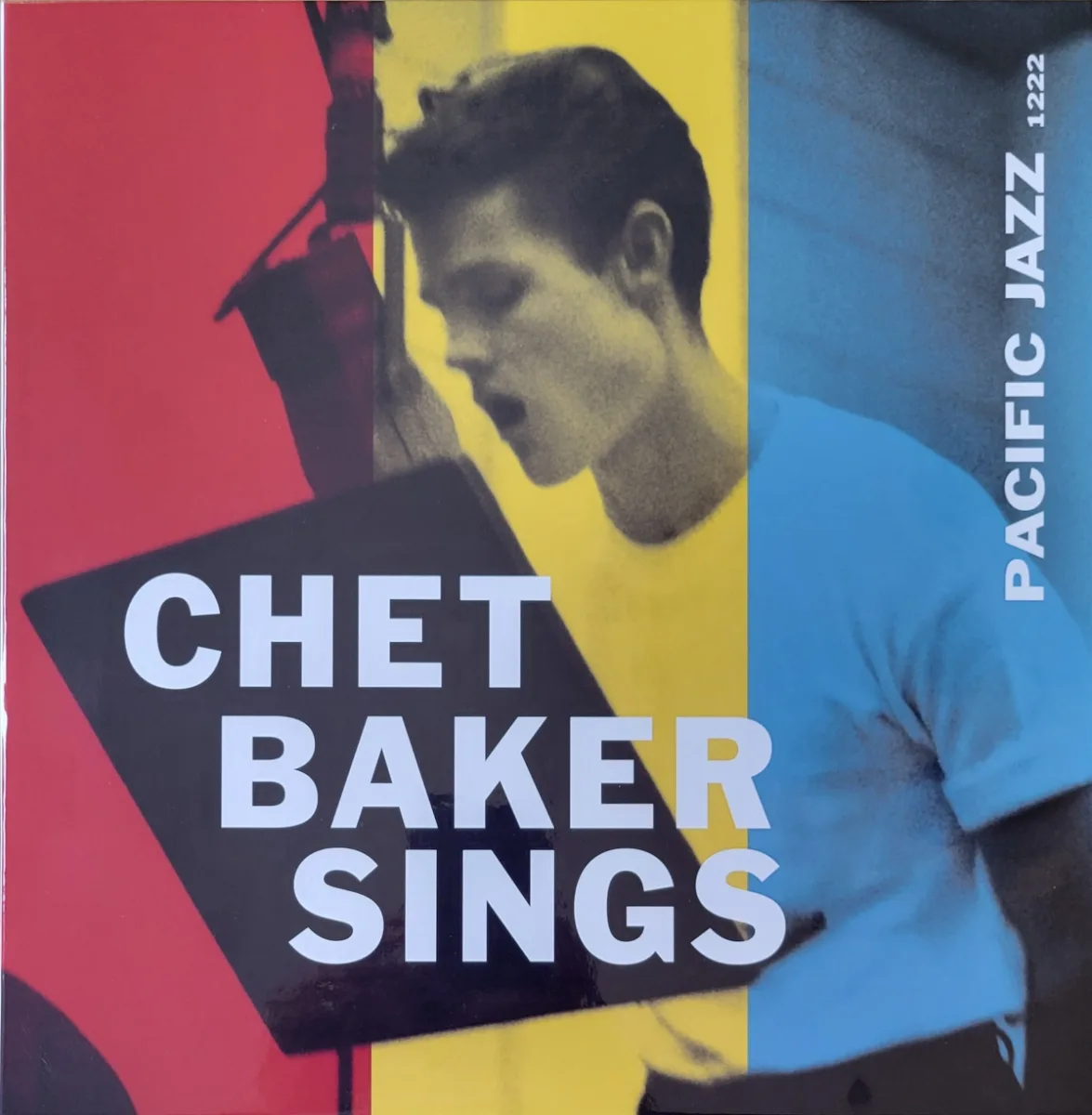 Album cover: Photo of Chet Baker at a microphone, singing