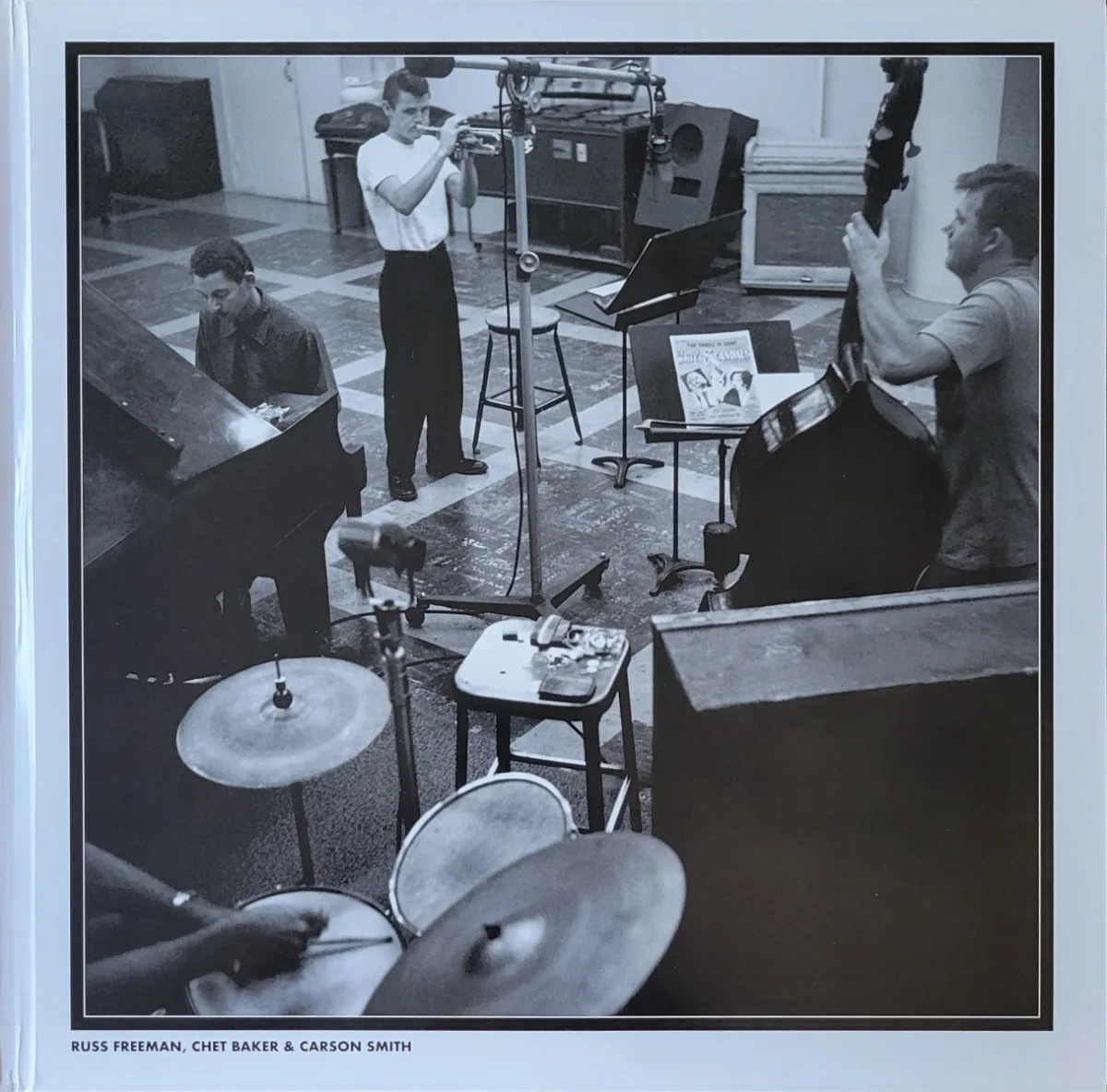 B&W studio photo of musicians including Chet Baker on trumpet