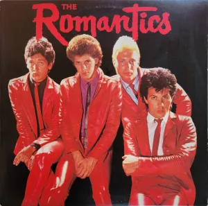 The Romantics posing for the camera in red leather suits