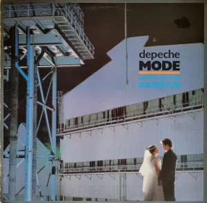 Album cover: photo of a bride and groom on an industrial platform (dock?)